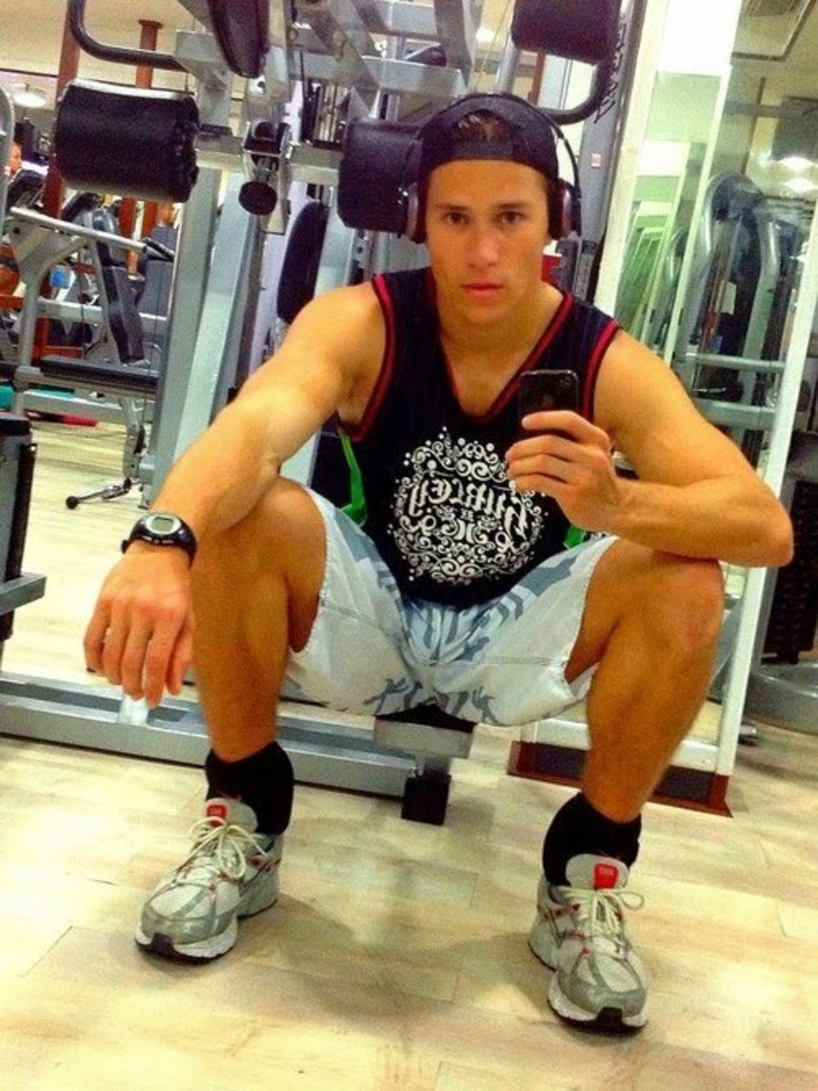 guy posing in a gym